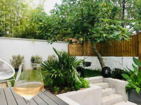 Maison lumineuse de 100m2 avec jardin et parking.